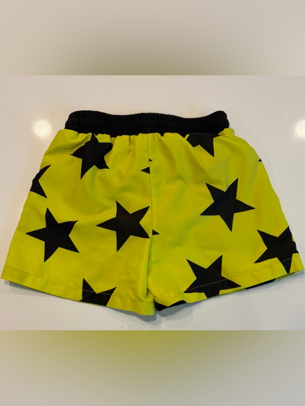 nununu Black Swim Shorts with Neon Yellow Lining and Star Detail - Picture 3 of 3
